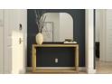 Welcoming entryway with a stylish wooden console table, mirror, decorative vase, and artwork enhancing the space at 4784 S 232Nd Ln, Buckeye, AZ 85326