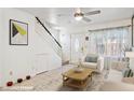 Inviting living room area with staircase, plush carpet, and natural light at 510 N Alma School Rd # 139, Mesa, AZ 85201
