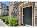 Inviting front entrance with stone accents and lush landscaping at 5729 S 21St Ter, Phoenix, AZ 85040