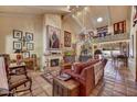 Comfortable living room features a fireplace, tile flooring, and access to the dining area at 5738 N Scottsdale Rd, Scottsdale, AZ 85253