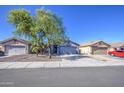 Charming single-story home featuring desert landscaping and a two-car garage at 6428 W Cordes Rd, Phoenix, AZ 85043