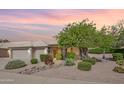 Charming home exterior with mature landscaping, a lush tree, and a well-maintained yard at 722 N Butte Ave, Chandler, AZ 85226