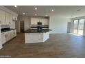 Spacious eat-in kitchen with an island and stainless steel appliances at 7433 W Rovey Ave, Glendale, AZ 85303