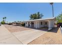 Street view of a single story home with a covered car port and desert landscaping at 808 N 78Th St, Scottsdale, AZ 85257