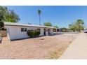 Single-story home featuring desert landscaping, a walkway, and a covered porch at 808 N 78Th St, Scottsdale, AZ 85257