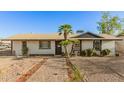Charming single-story home with desert landscaping and a brick walkway leading to the front door at 8717 W Turney Ave, Phoenix, AZ 85037