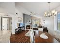 Spacious living and dining area featuring a fireplace, balcony access, and seamlessly connected to the kitchen at 10401 N 52Nd St # 210, Paradise Valley, AZ 85253