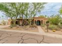 Wide angle front exterior view with desert landscaping and a red tile roof at 11051 N 45Th Pl, Phoenix, AZ 85028