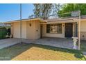 Welcoming entryway with a covered patio and a well manicured lawn at 15610 N 98Th Ave # 26, Sun City, AZ 85351