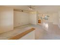 Spacious living room with neutral carpet flooring and ceiling fans at 15610 N 98Th Ave # 26, Sun City, AZ 85351