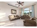 Cozy living room featuring neutral tones, a large window, and comfortable seating arrangement at 2406 E Oakland St, Chandler, AZ 85225