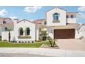 Beautiful two-story home featuring a red tile roof, manicured lawn, and a spacious two car garage at 2454 W Hope Cir, Chandler, AZ 85248