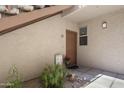 Inviting entryway featuring a decorated door, plants, and welcome decor at 29606 N Tatum Blvd # 174, Cave Creek, AZ 85331