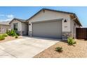 Well-maintained single-story home with gravel landscaping and an attached two-car garage in a modern community at 31619 N Shady Pasture Ln, San Tan Valley, AZ 85143