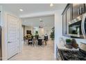 Bright open-concept dining area with modern furnishings, seamlessly connected to living spaces at 3335 S Lily Ave, Mesa, AZ 85212