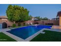 A beautiful backyard pool and patio with a relaxing seating area, perfect for entertaining at 4337 S Helix --, Mesa, AZ 85212