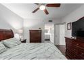 Comfortable bedroom with ceiling fan and access to an en-suite bathroom at 4554 E Paradise Village Pkwy # 267, Phoenix, AZ 85032