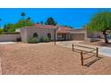 Desert landscaping and a basketball hoop highlight the front of this charming single-story home at 509 W Boxelder Pl, Chandler, AZ 85225