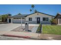 Charming single-story home with desert landscaping, a spacious driveway, and a welcoming entrance at 520 N 23Rd St, Mesa, AZ 85213