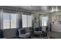 Cozy sitting area filled with natural light showcases modern decor and comfortable seating at 6421 S 23Rd Dr, Phoenix, AZ 85041