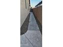 Concrete walkway along the side of the house, leading to a gated entrance at 6722 W Shannon St, Chandler, AZ 85226
