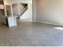 Open-concept living space featuring tile floors and a seamless transition to the kitchen area at 7209 E Blissful Breeze Ln, San Tan Valley, AZ 85143