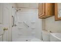 Clean bathroom with a walk-in shower, grab bars, and neutral decor at 7750 E Broadway Rd # 361, Mesa, AZ 85208