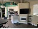 Bright kitchen with white cabinetry, stainless steel appliances, and breakfast bar at 111 S Greenfield Rd # 785, Mesa, AZ 85206