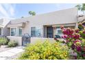 Charming front patio with beautiful plants, offering a cozy and inviting entrance at 14300 W Bell Rd # 222, Surprise, AZ 85374