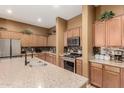 Well-equipped kitchen featuring stainless steel appliances, granite countertops, and plenty of cabinet space at 16600 W Washington St, Goodyear, AZ 85338