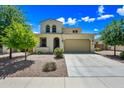 Lovely two-story home featuring a well-maintained front yard and two-car garage at 20251 W Hadley St, Buckeye, AZ 85326