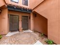 Inviting courtyard with dual entrances and brick accents provides a charming welcome at 20660 N 40Th St # 1118, Phoenix, AZ 85050