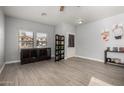 Cozy living area with wood-look floors, bright natural light, and access to the home's exterior at 2116 S Shelby --, Mesa, AZ 85209