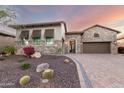 Landscaped front yard featuring cacti, gravel, and a charming stone and stucco facade at 2166 N Steele --, Mesa, AZ 85207