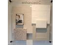 Samples showcasing interior design options, including neutral-toned carpet, tiles, wall paint, and cabinet finishes at 22382 W Monona Ln, Surprise, AZ 85387