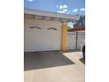 A well maintained garage features a white door and ample driveway space at 3041 E Osborn Rd, Phoenix, AZ 85016