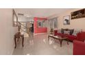 Bright living room with tile flooring, stylish furniture, and large windows at 3443 W Saint Anne Ave, Phoenix, AZ 85041