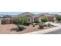Attractive home exterior with well-maintained desert landscaping and convenient driveway at 4001 N 300Th Ln, Buckeye, AZ 85396