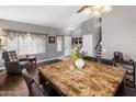 Bright dining area with marble table top and leather chairs, perfect for Gathering gatherings at 4118 W Fallen Leaf Ln, Glendale, AZ 85310