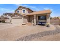 Charming front of the home with covered porch and gravel landscaping for low maintenance appeal at 4118 W Fallen Leaf Ln, Glendale, AZ 85310