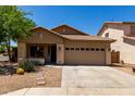Charming single-story home featuring a well-maintained front yard and a two-car garage at 4216 N Dania Ct, Litchfield Park, AZ 85340