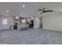 Open-concept kitchen with island seating and modern stainless steel appliances, perfect for entertaining at 542 E Flynn Ln, Phoenix, AZ 85012