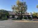 Spacious backyard with mature trees, beautiful patio and mountain backdrop at 5635 E Lincoln Dr # 26, Paradise Valley, AZ 85253