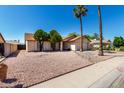Charming single-Gathering home featuring desert landscaping, shade trees and a two-car garage at 8157 W Mclellan Rd, Glendale, AZ 85303