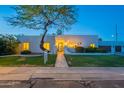 Charming home with a unique tree in the front yard, beautiful landscaping and an inviting entryway at 10532 N 79Th St, Scottsdale, AZ 85258