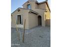 View of home's front entrance with a well-maintained yard with stone at 10984 N 164Th Dr, Surprise, AZ 85388