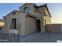 View of home's front entrance with a well-maintained yard with stone at 10984 N 164Th Dr, Surprise, AZ 85388
