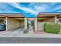 Charming townhouse with covered parking and landscaped front entrance at 1146 E Rovey Ave, Phoenix, AZ 85014