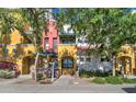 Charming townhouse exterior featuring colorful accents, well-maintained landscaping, and inviting front entrances at 123 N Washington St # 16, Chandler, AZ 85225