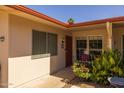 Quaint exterior featuring a covered entry and colorful landscaping at 13211 W Aleppo Dr, Sun City West, AZ 85375